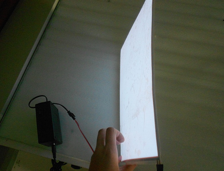 A Small A6 White Color El Panel With Electrical Connections/Power Source